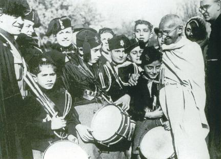 Visits Vatican and meets Mussolini