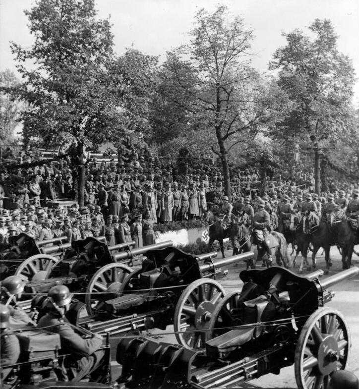 Attends victory parade in Warsaw
