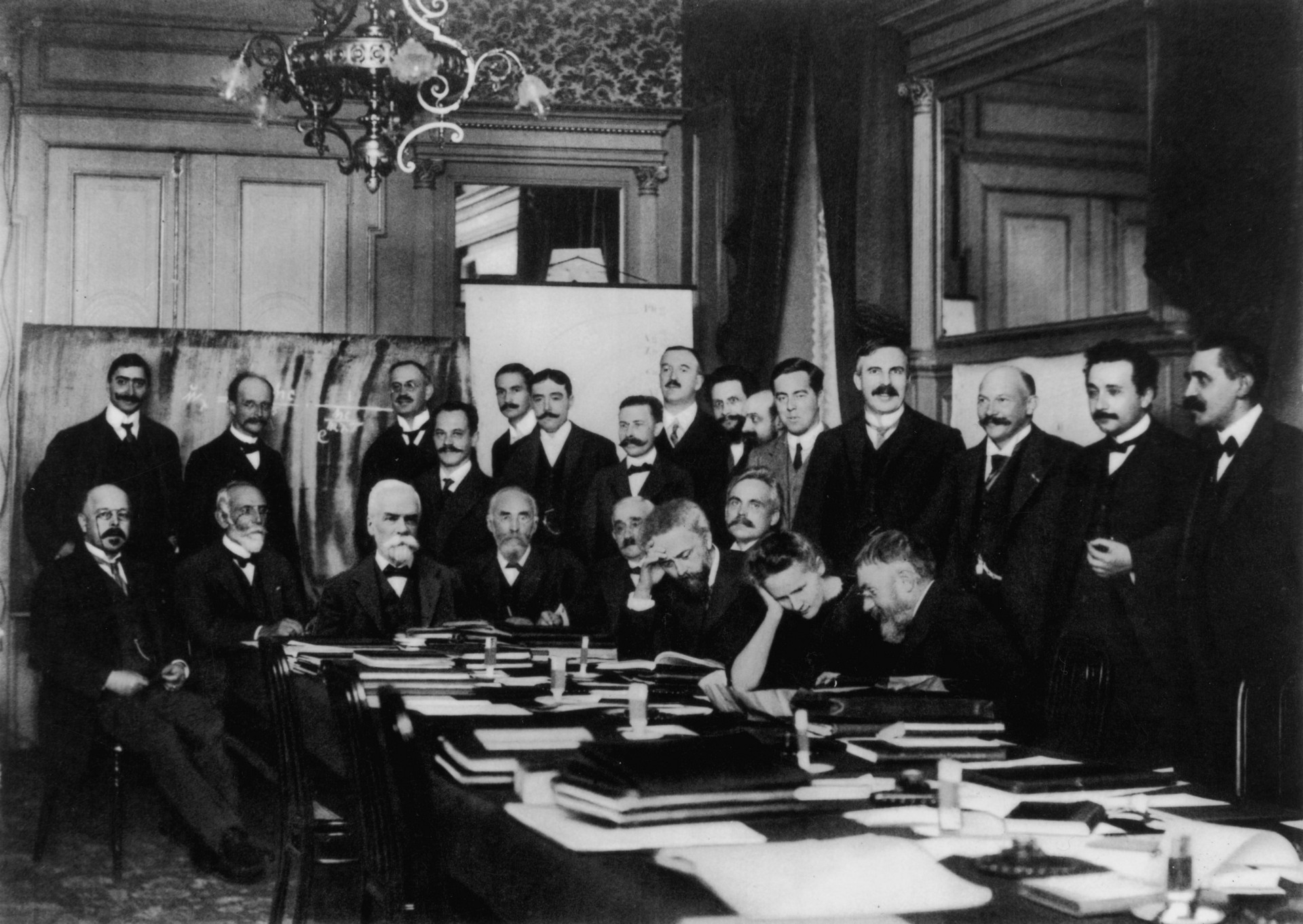 Attends first Solvay Conference